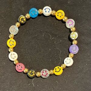 Smiley face bracelet. 7.75 inches.